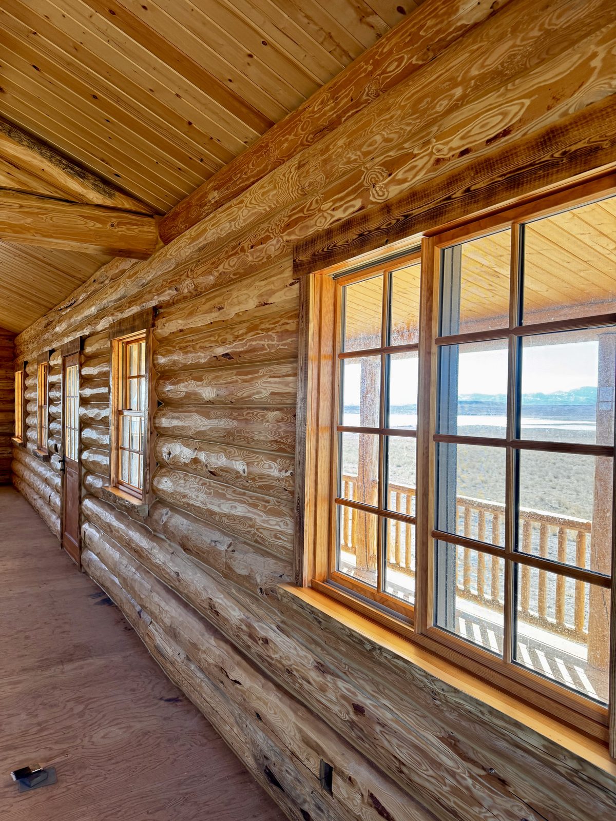 Circle-sawn fir trim and live-edge log window sills, Augusta MT