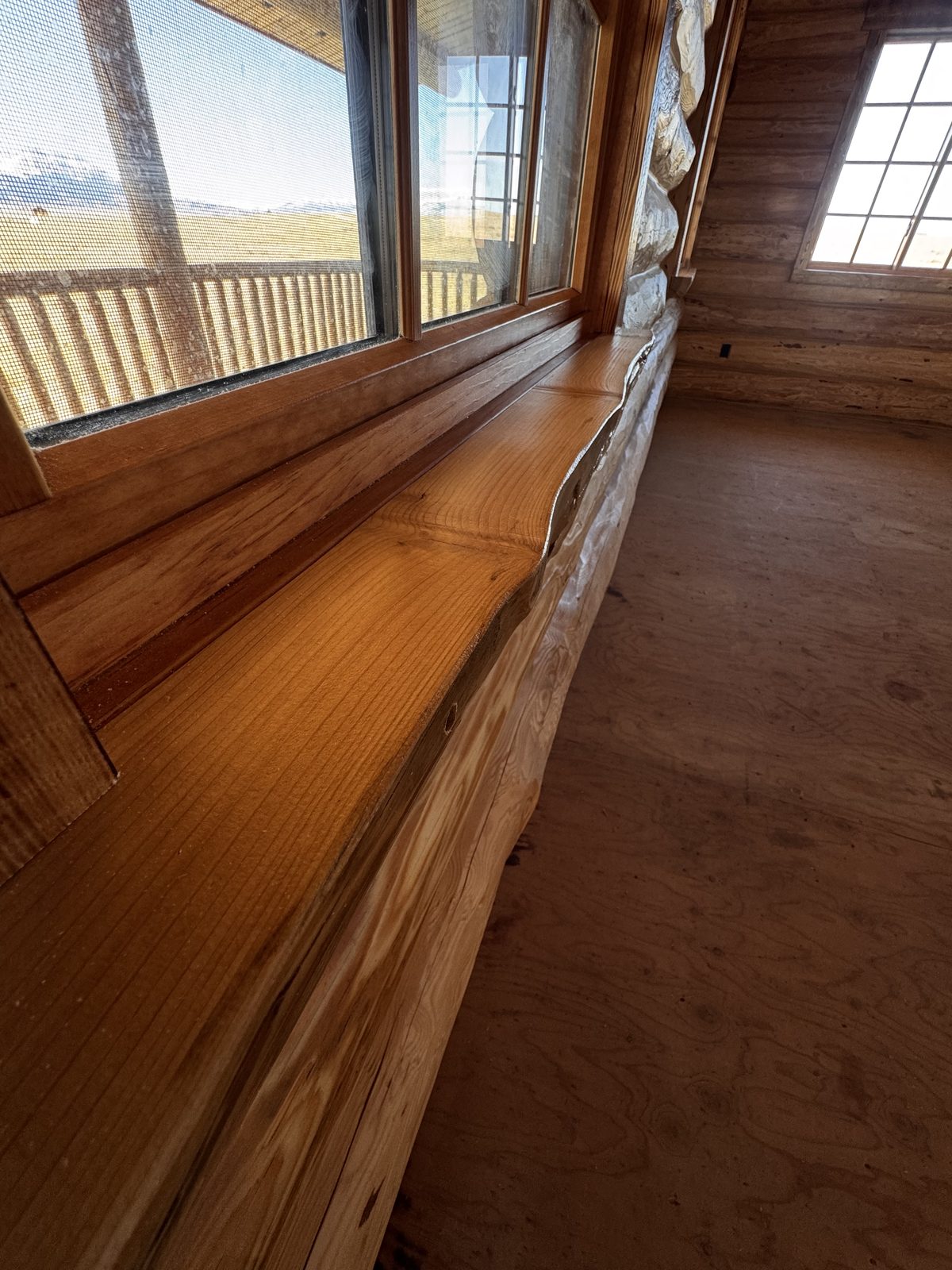 Close-up of finished live-edge log window sill