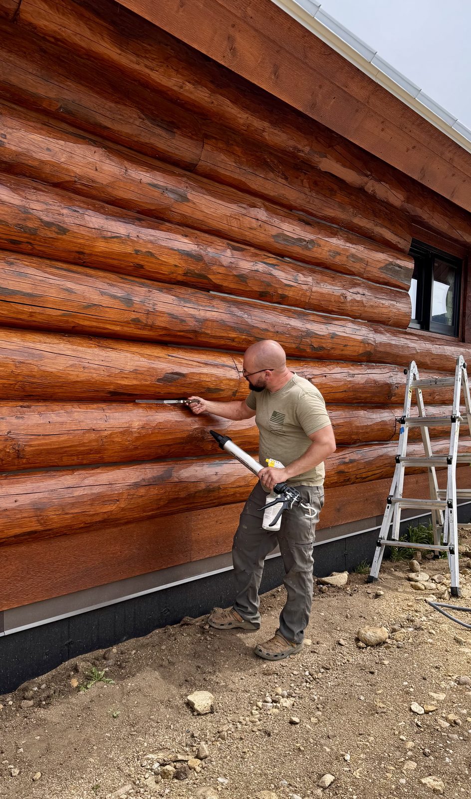 Chinking and mahogany stain on log home, Red Lodge MT