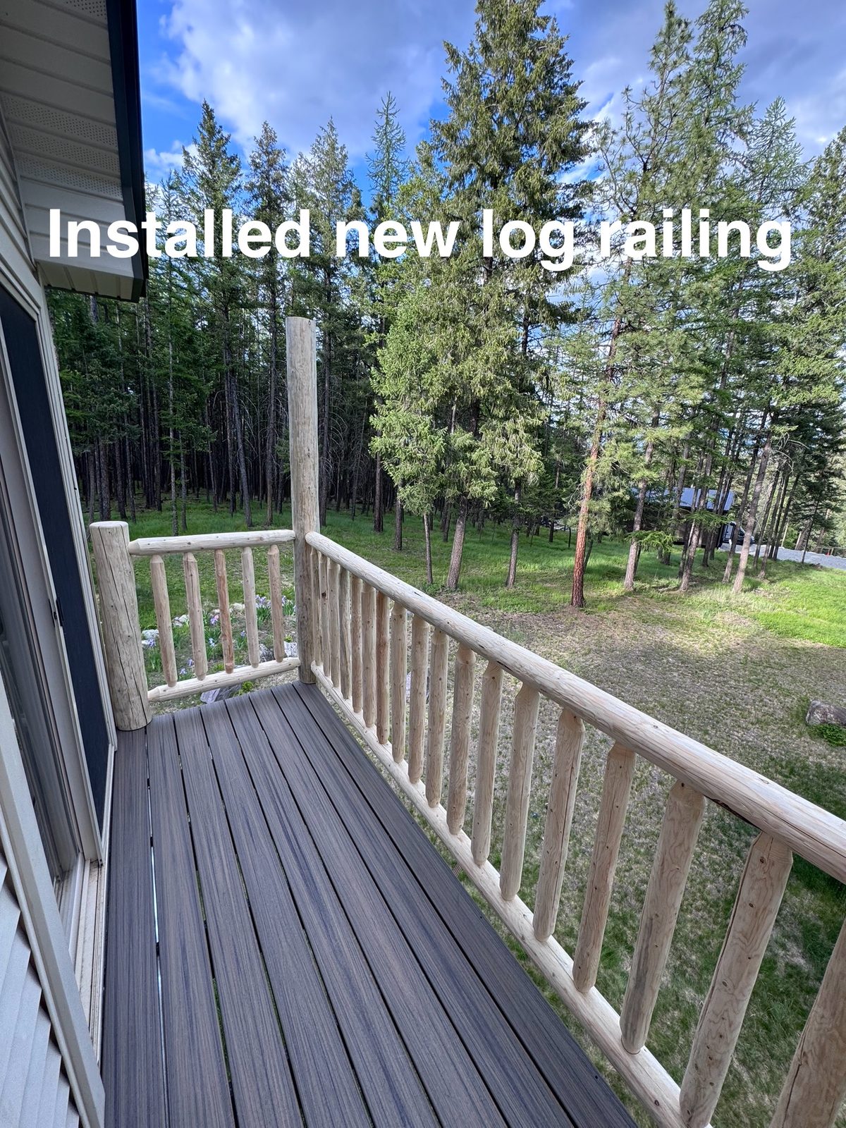 New log railing installed on deck